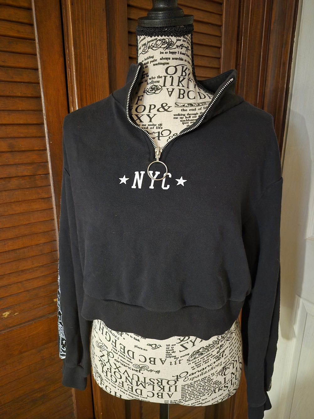 Divided Black Cropped Bomber-Style Pullover with Ring Zip